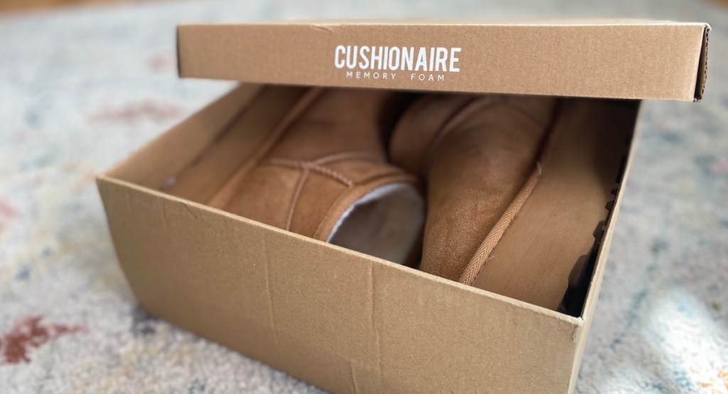 cushionaire box with boots inside on the carpet