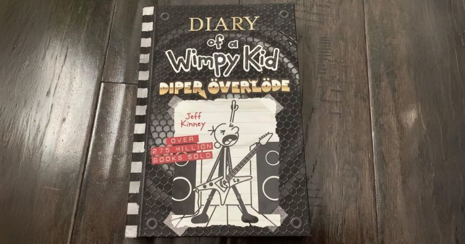 book cover of diary of a wimpy kid diper overloade