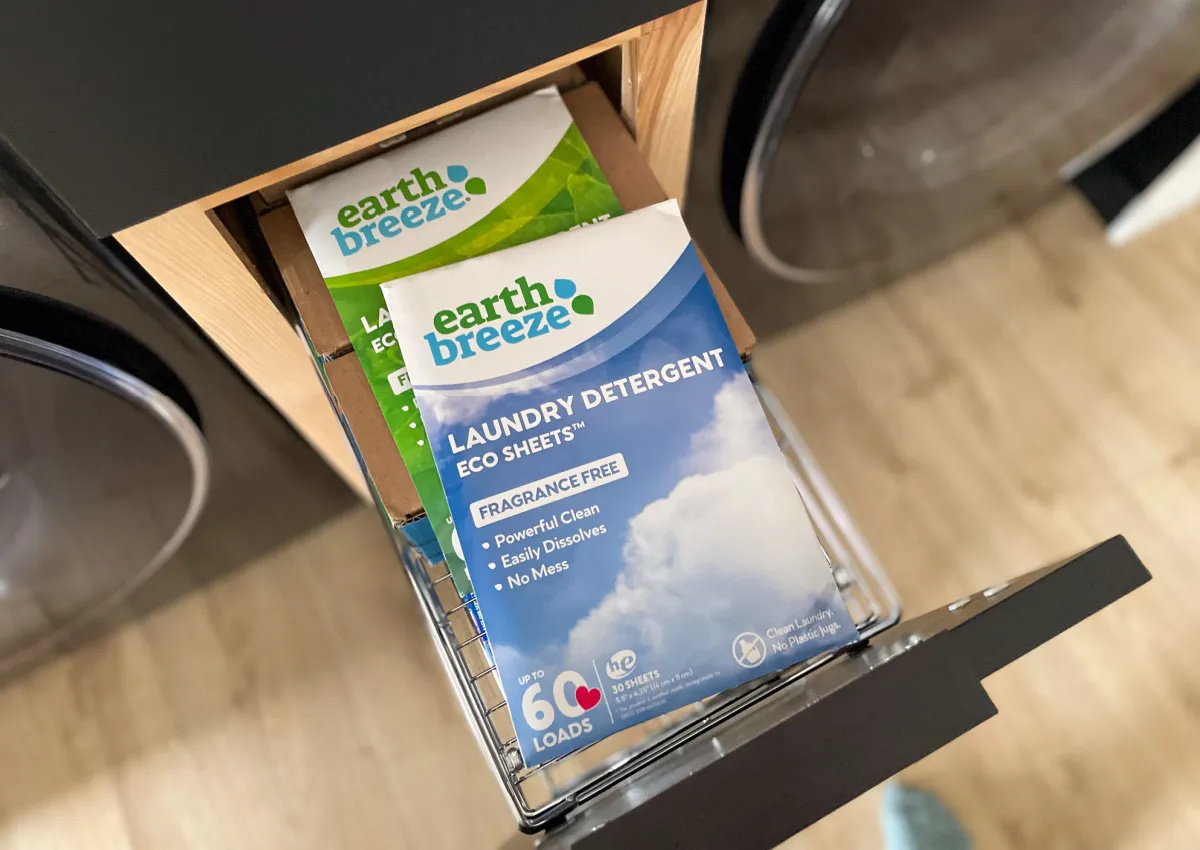 packages of earth breeze laundry sheets in a laundry room drawer