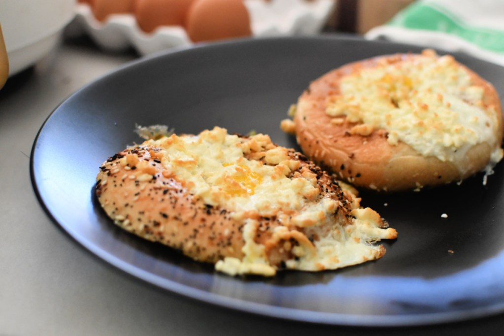 eggs in a bagel with feta cheese on top