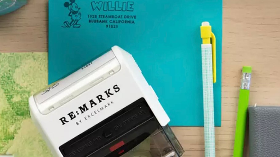 remark self inking stamps with blue envelope and pen 