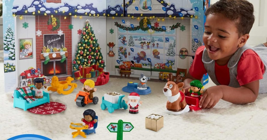 child playing with a fisher price advent calendar