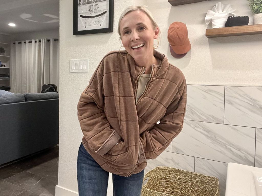 a woman modeling a forever 21 quilted jacket in brown