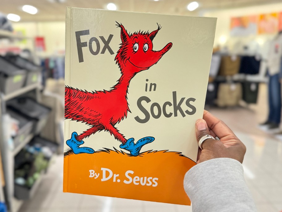 hamd holding fox in socks dr suess book in store