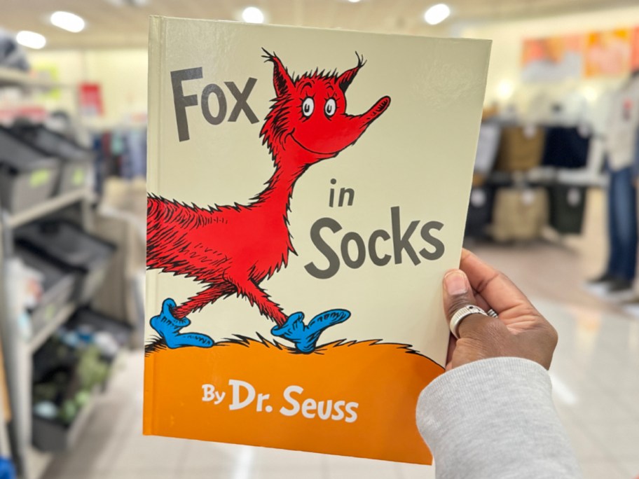 hamd holding fox in socks dr suess book in store