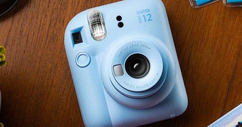 light blue camera on table