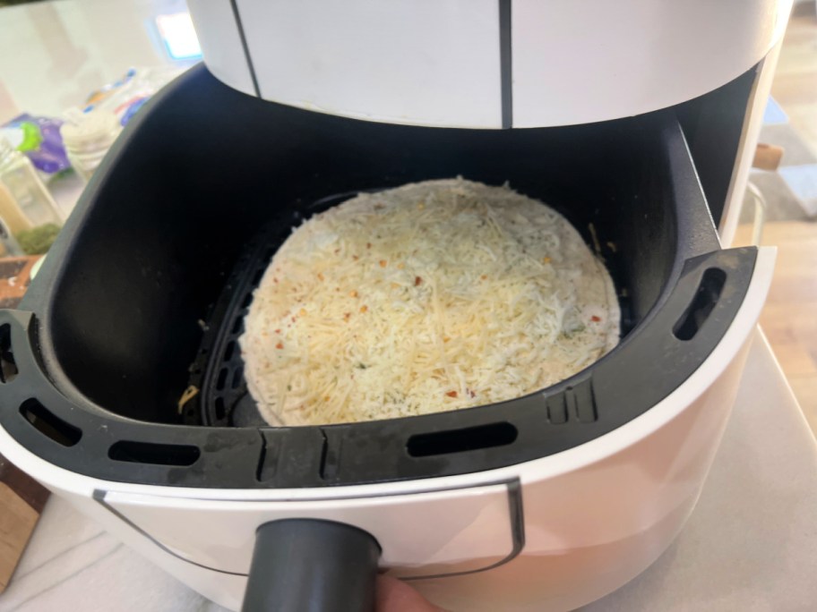 garlic bread quesadilla inside an air fryer