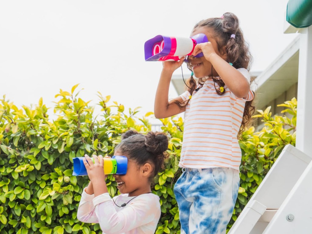 two children using binoculars