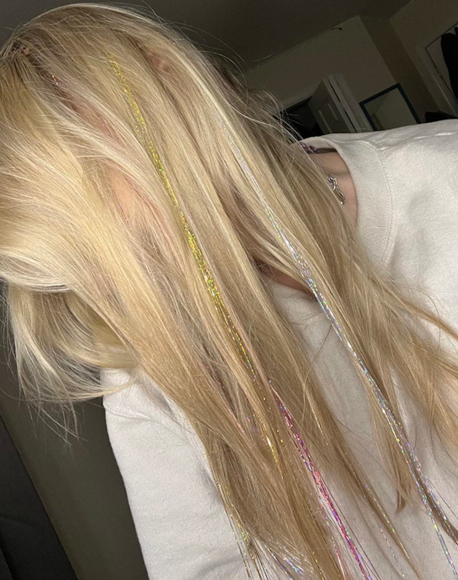 Close up of girl with blonde hair and glitter tinsile