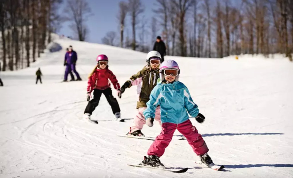 kids skiing on hill