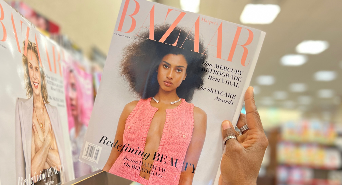 hand holding bazaar magazine in the store