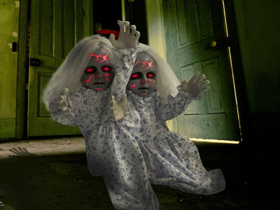 zombie doll animatronic in haunted hallway
