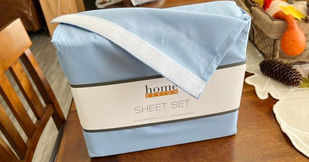 macys blue home design sheet set in packaging sitting on table