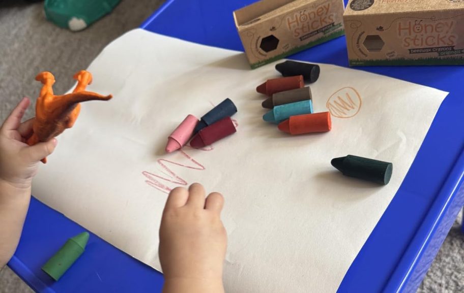 toddler drawing with honeysticks crayons