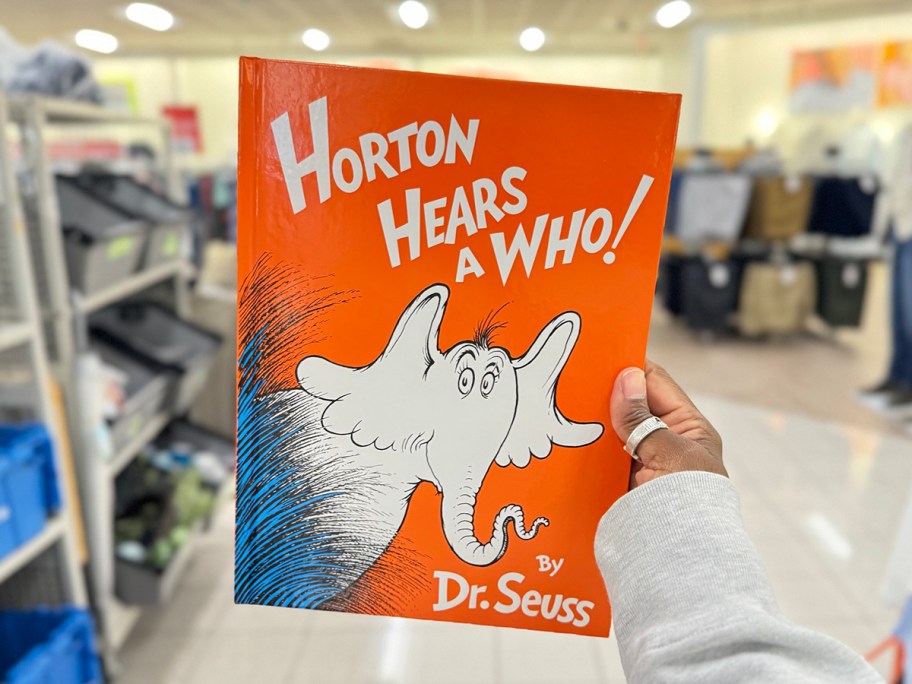 hand holding horton hears a who book in store