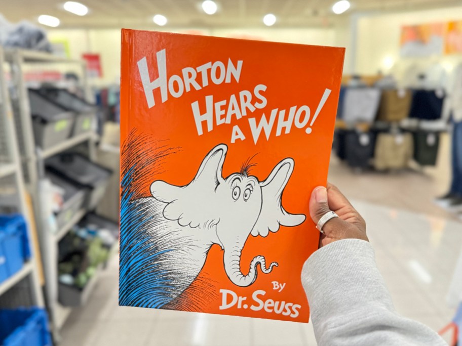 hand holding horton hears a who book in store