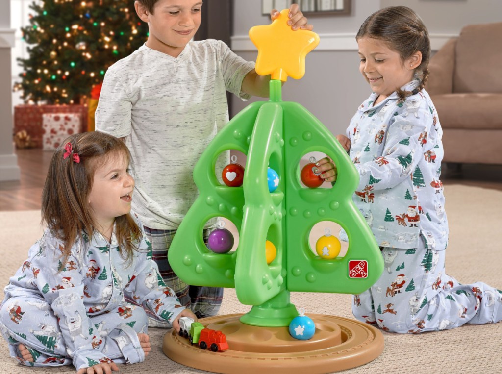 kids playing with their step2 Christmas tree