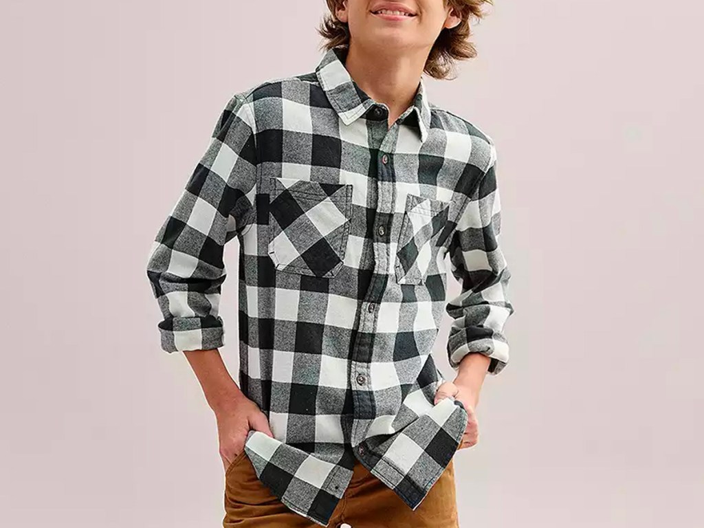 boy wearing black and white flannel