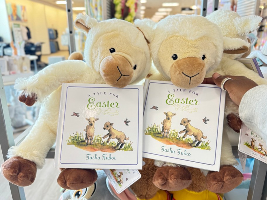 hand holding lamb plush and book bundle in kohls store