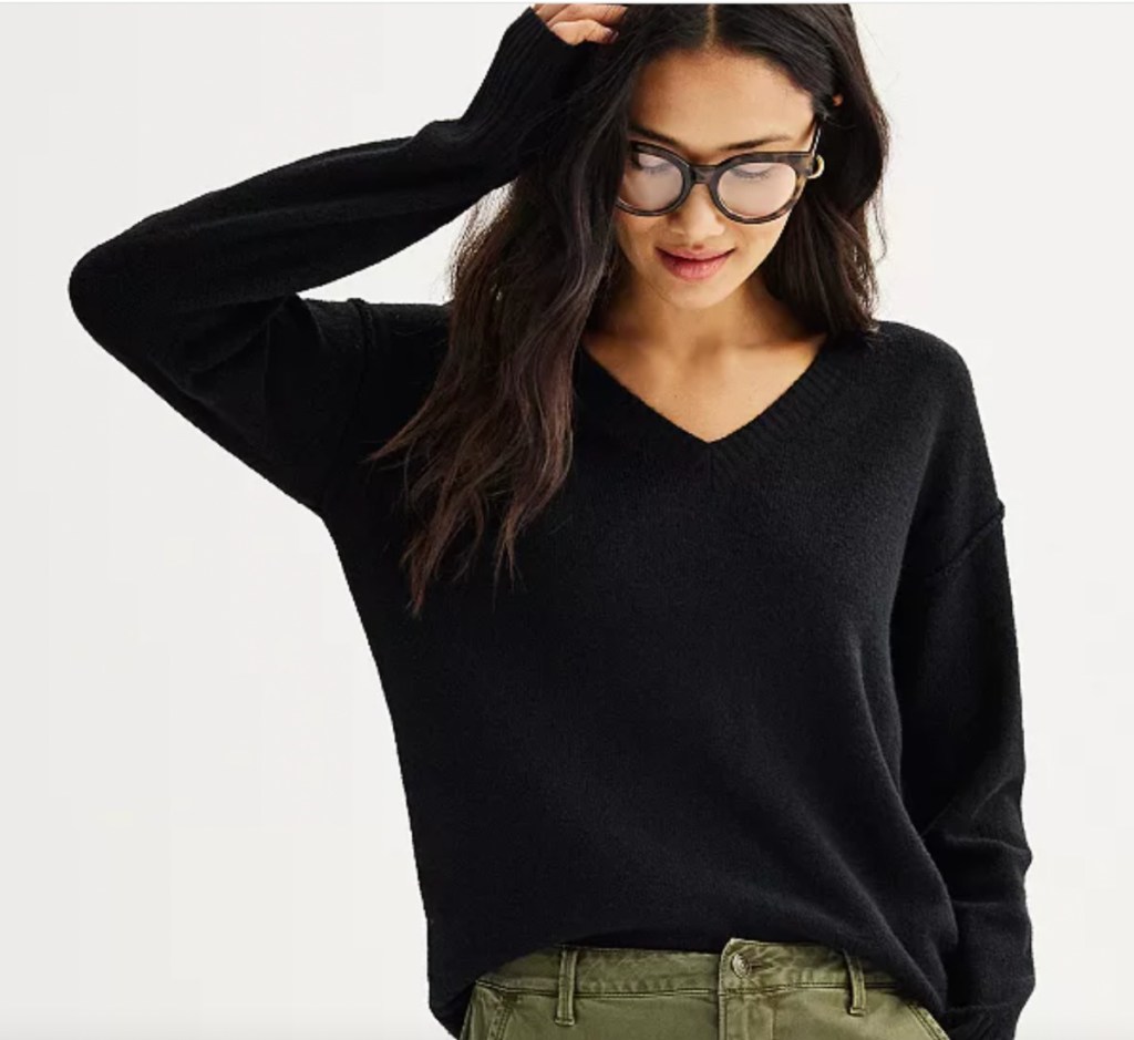 woman wearing black v neck sweater