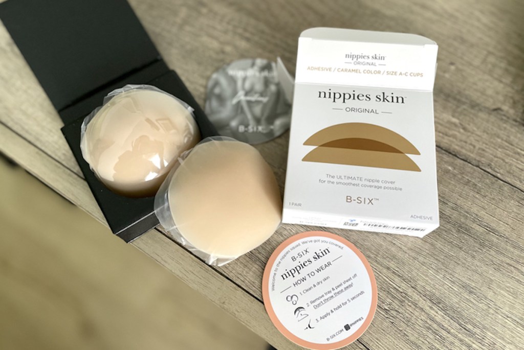 nippies skin product with box and packaging on wood dresser