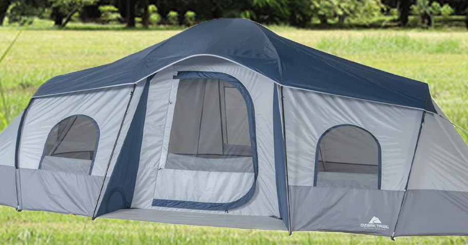 gray and blue ozark trail tent with grass background