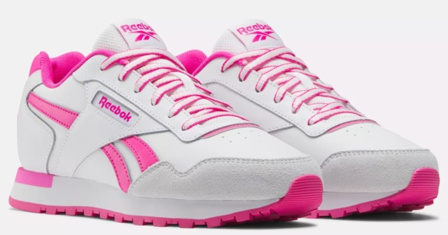 pair of white and hot pink Reebok kid's classic style shoes