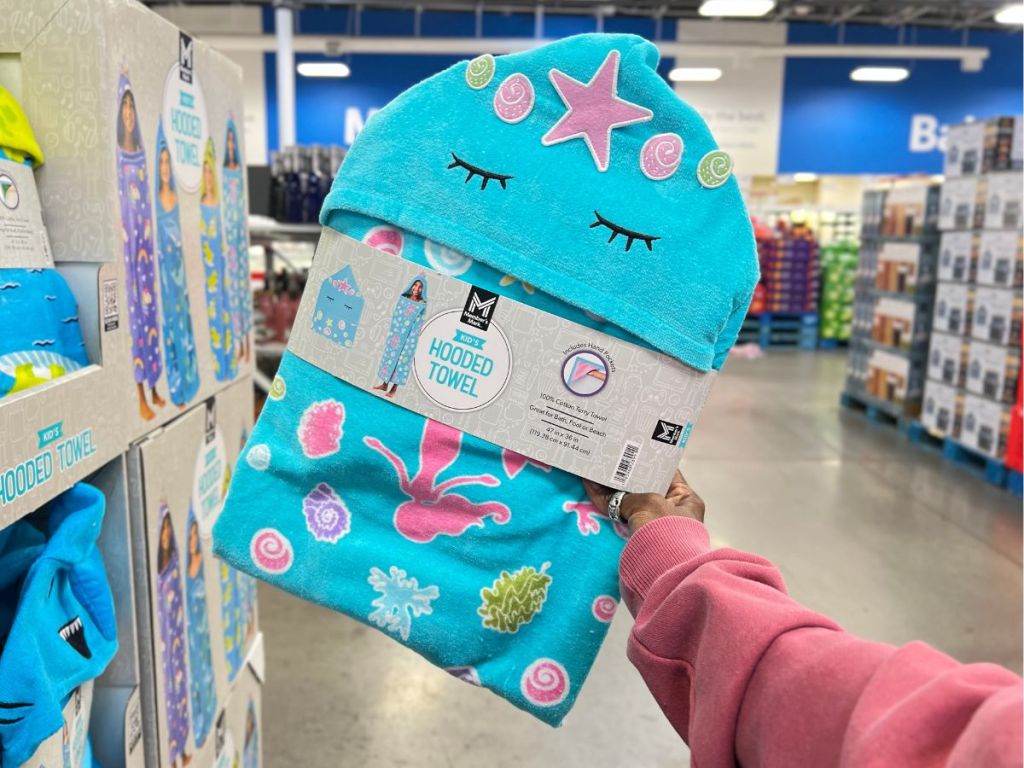 hand holding a Mermaid Kid's Hooded towel in store at Sam's Club