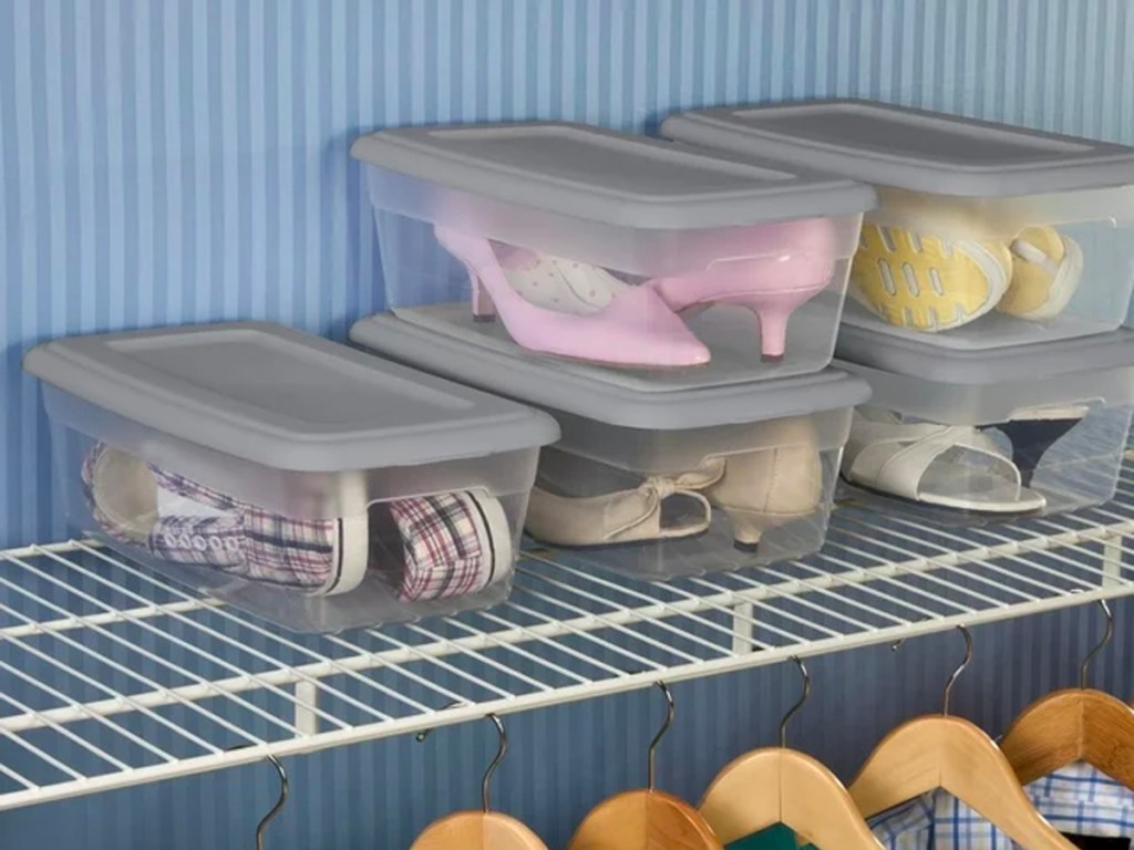 clear storage boxes with gray lids on shelf