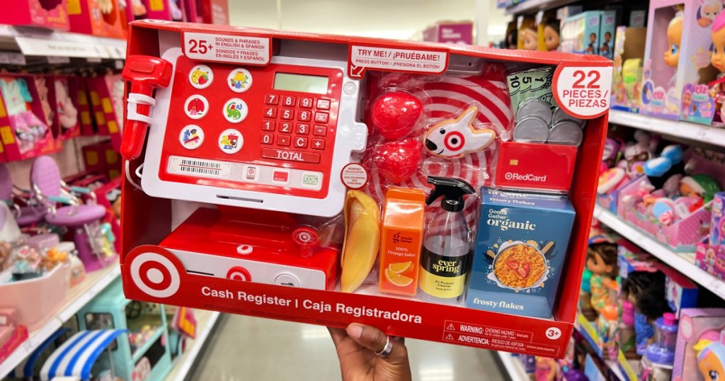 target cash register in hand in a store aisle