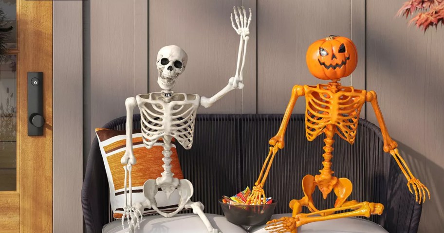 skeleton and pumpkin skeleton decor on porch