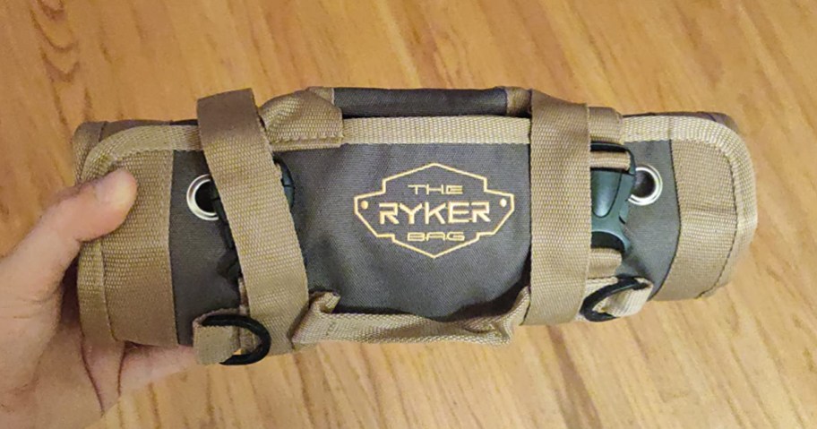 holding a tool roll bag