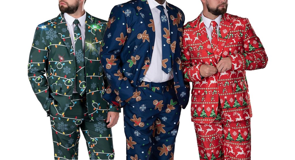 three men wearing Christmas suits standing together 