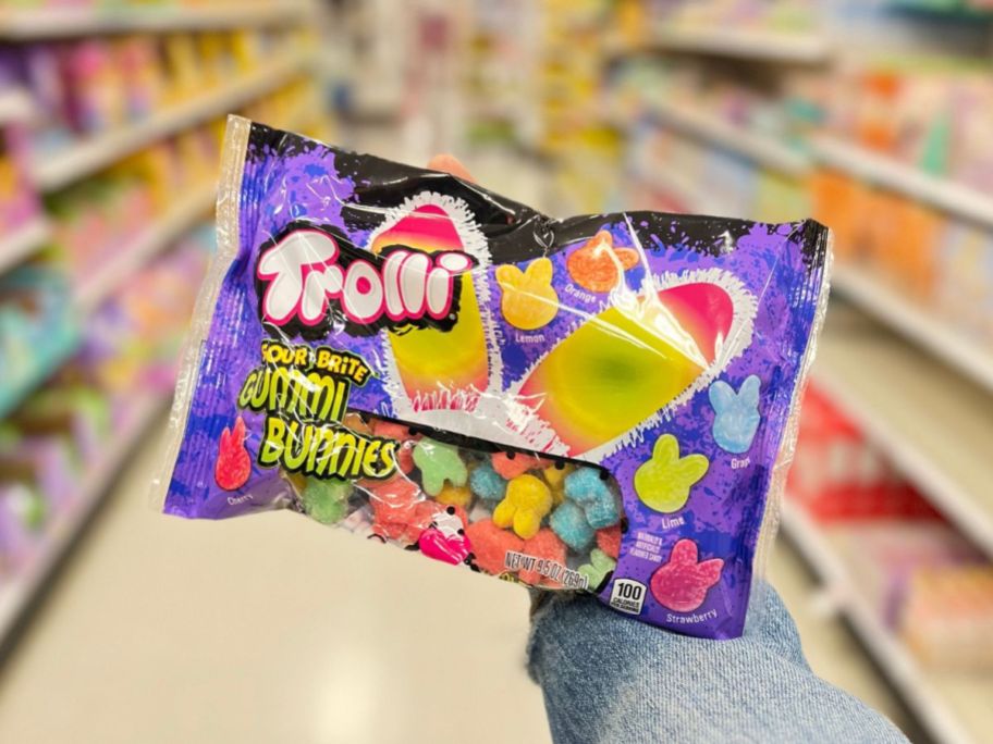 hand holding up trolli easter candy