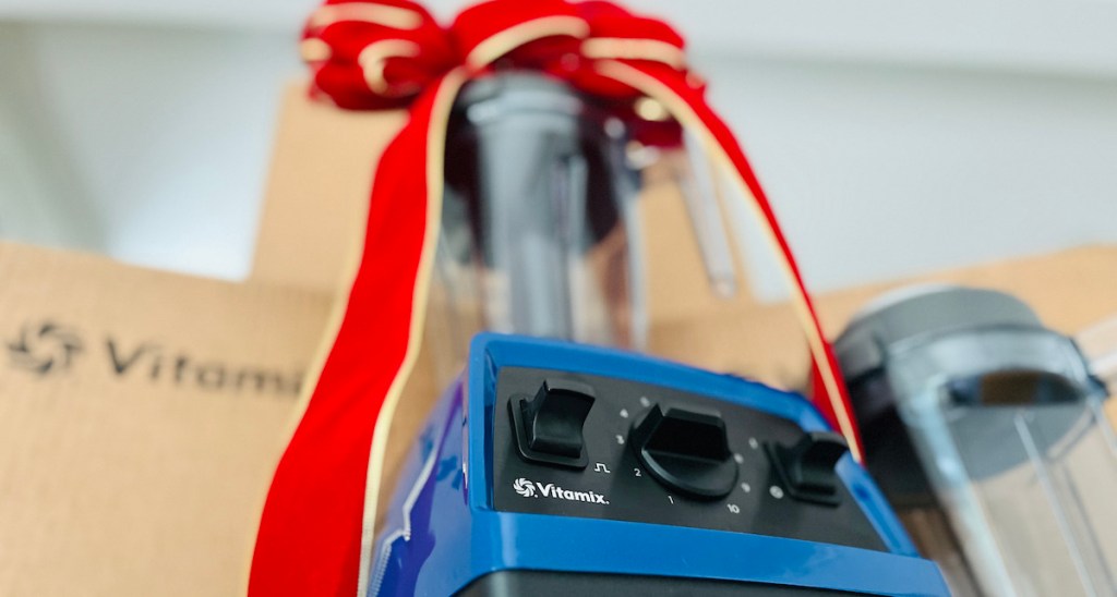 Close-up of vitamix, blender logo sitting on the counter with big red bow