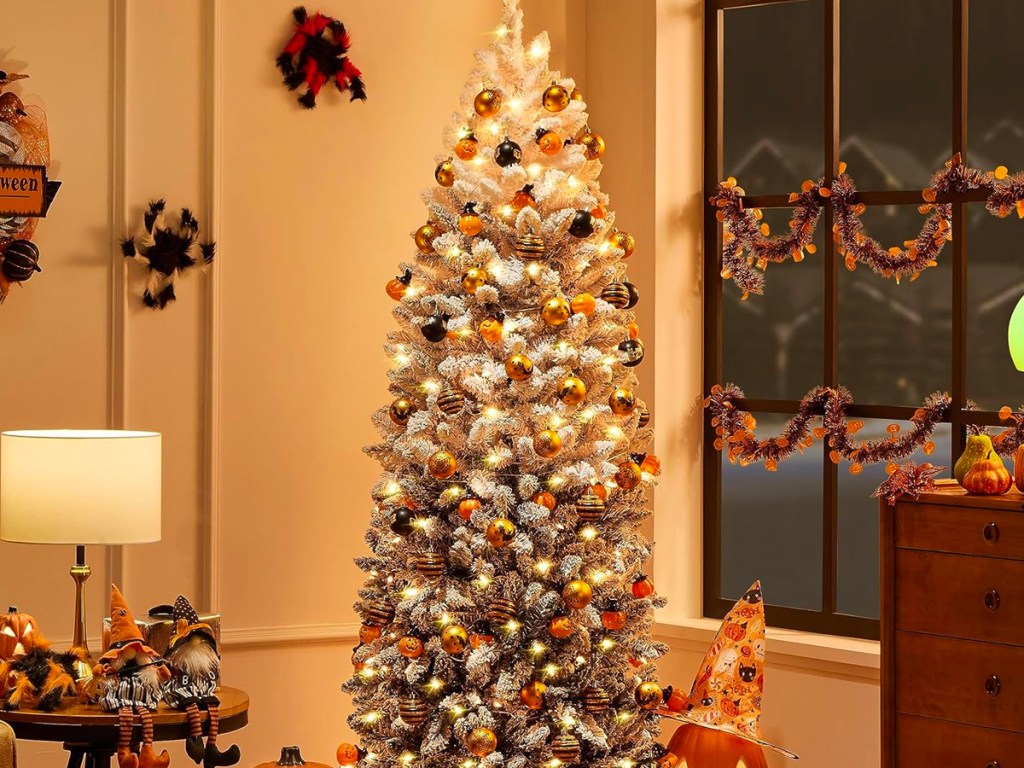 white christmas tree decorated with halloween ornaments