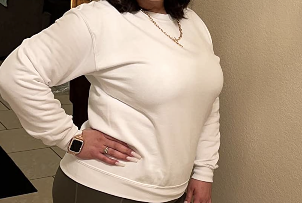 woman wearing white sweatshirt