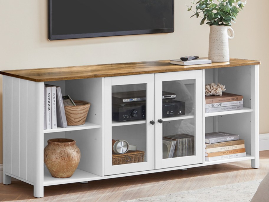 white tv console with items on it