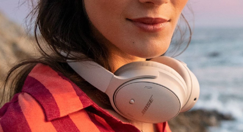 woman wearing a Bose headset around her neck