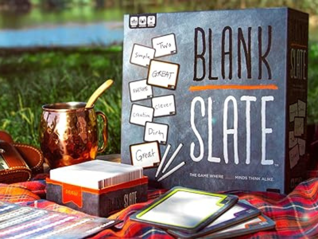 Blank Slate board game on a picnic blanket with drinks