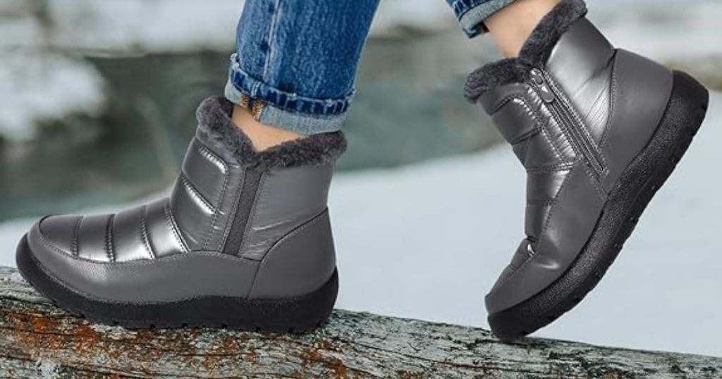 woman walking on a log wearing Shibever Women's Waterproof Winter Boots in grey