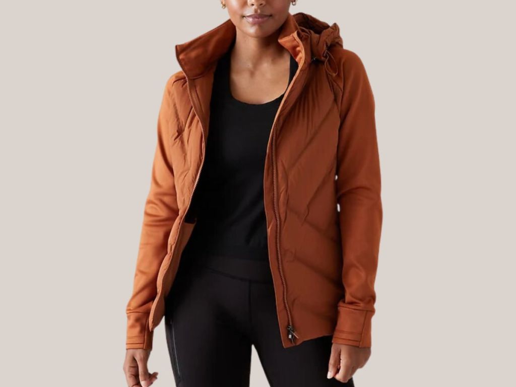 woman wearing a brownish orange Athlet jacket