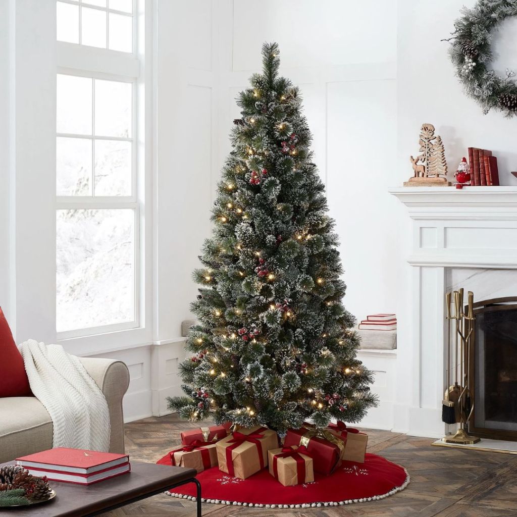 6.5 foot glittering pre-lit Christmas tree in living room