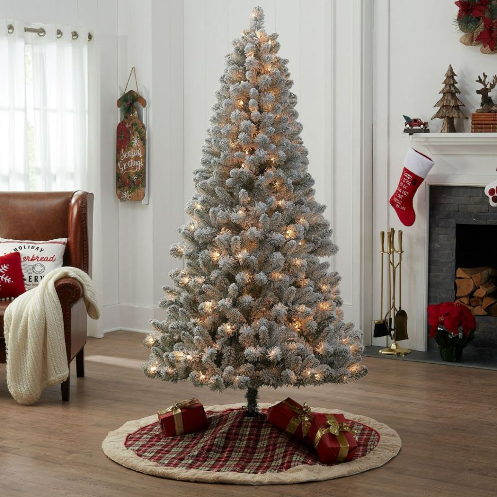 6.5 pre-lit flocked Christmas tree in living room