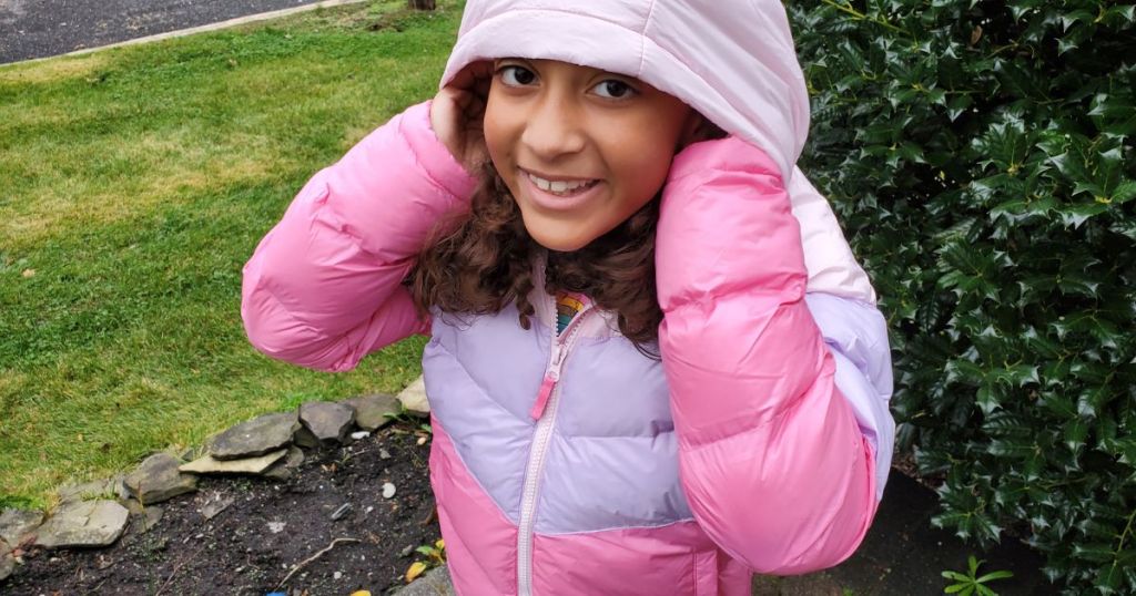 little girl wearing a 32 Degrees Girls Hooded Puffer Jacket