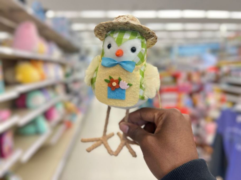 hand holding an Easter Fabric Bird with Straw Hat 