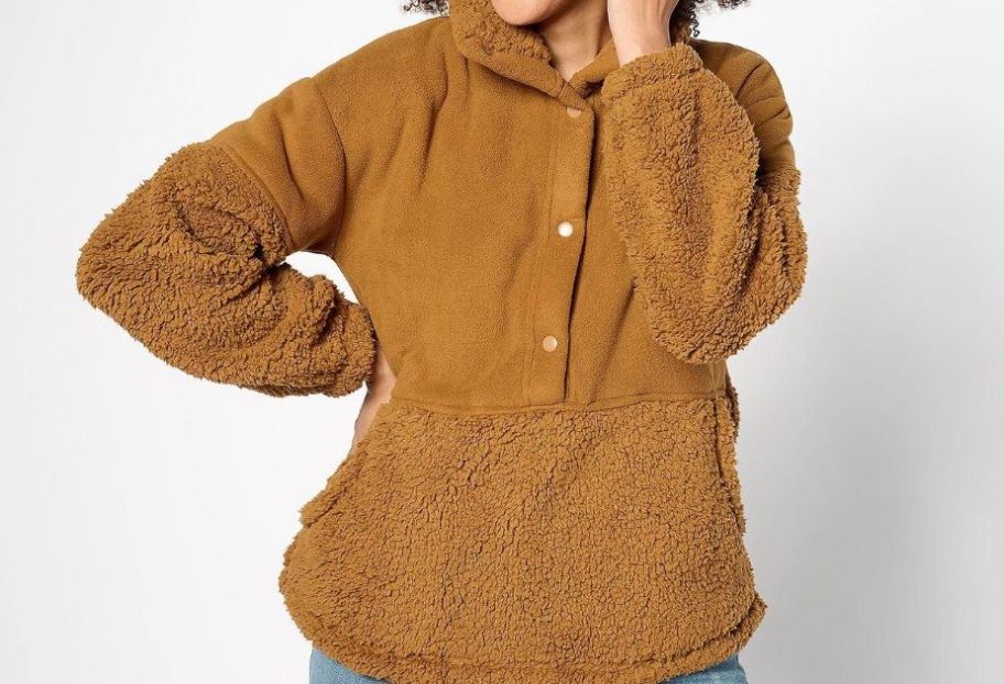 woman wearing a brown color sherpa pullover