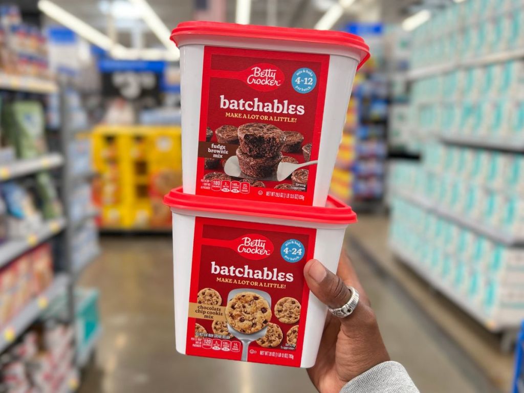 Betty Crocker Chocolate Chip Cookie Mix and Fudge Browni Mix Batchables in person's hand at Walmart