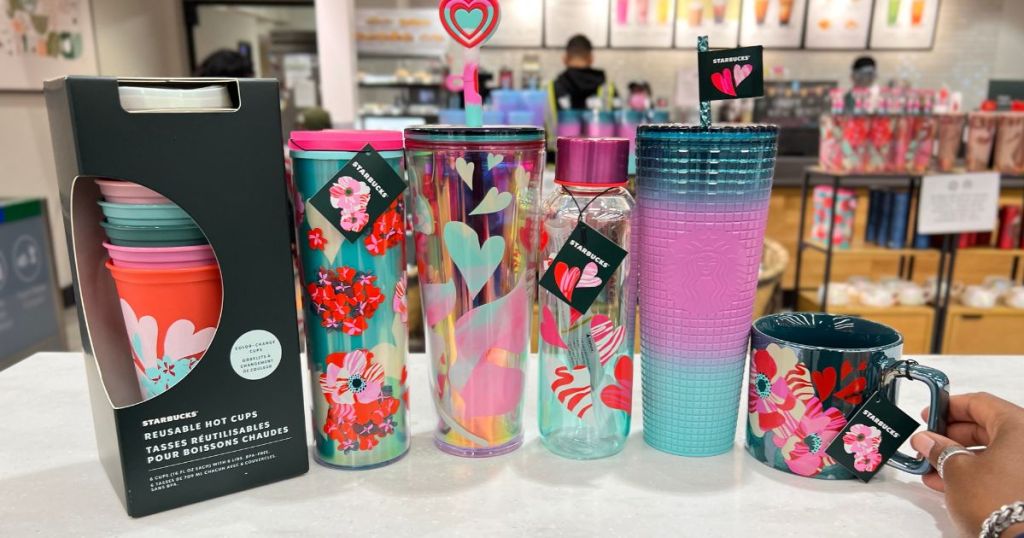 new Starbucks cups, mugs and tumblers lined up on shelf at Target in Valentines and Lunar New Year designs