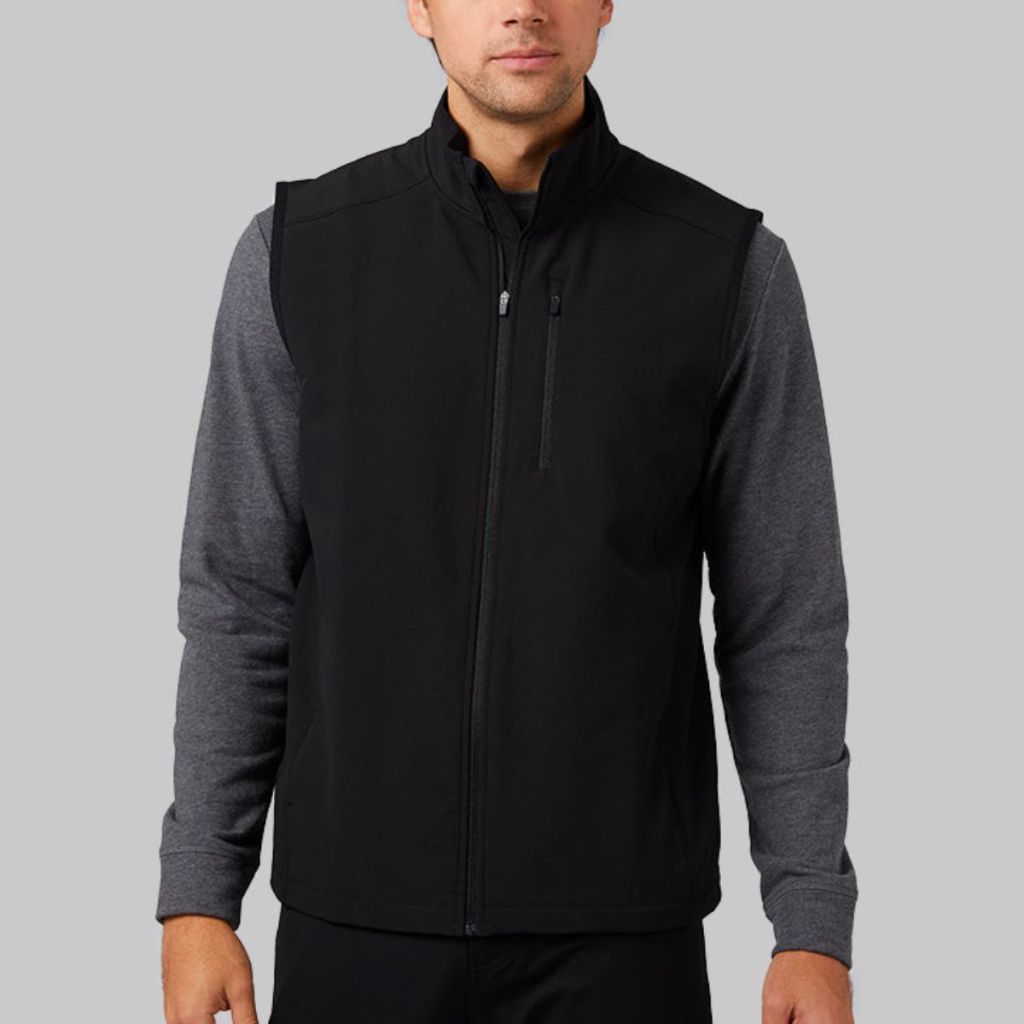a male model wearing a 32 Degrees Men's Pro Tech Lite Vest